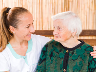 elderly woman with a caregiver