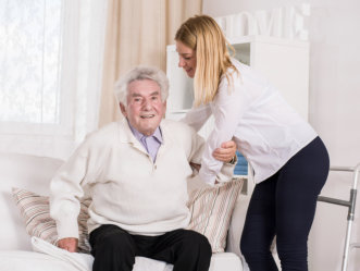 caregiver assisting elderly senior