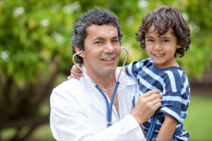 doctor and a young boy outdoor
