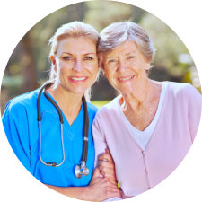 elderly woman and a woman smiling