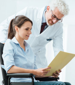 doctor and patient examining medical records